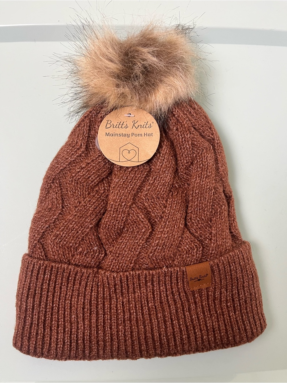 Cable Pom Beanie in Rust Brown